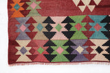Vintage kilim rug in living room setting, old rug, antique rug, pastel colors, faded colors, Turkish rug, vintage rug, soft rug, Portland, Oregon, rug store, rug shop, local shop, earthy tones, earthy colors, warm colors