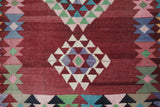 Vintage kilim rug in living room setting, old rug, antique rug, pastel colors, faded colors, Turkish rug, vintage rug, soft rug, Portland, Oregon, rug store, rug shop, local shop, earthy tones, earthy colors, warm colors