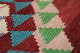 Vintage kilim rug in living room setting, old rug, antique rug, pastel colors, faded colors, Turkish rug, vintage rug, soft rug, Portland, Oregon, rug store, rug shop, local shop, earthy tones, earthy colors, warm colors