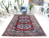 Vintage Turkish rug in a living room setting, Area rug in a living room setting, pile rug, Turkish rug, custom rug, modern rug, portland, rug shop, bright colors, wild shaman, soft rug, bold color, Portland, Oregon, rug store, rug shop, local shop