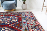 Vintage Turkish rug in a living room setting, Area rug in a living room setting, pile rug, Turkish rug, custom rug, modern rug, portland, rug shop, bright colors, wild shaman, soft rug, bold color, Portland, Oregon, rug store, rug shop, local shop