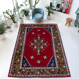 Vintage Turkish rug in a living room setting, Area rug in a living room setting, pile rug, Turkish rug, custom rug, modern rug, portland, rug shop, bright colors, wild shaman, soft rug, bold color, Portland, Oregon, rug store, rug shop, local shop