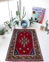 Vintage Turkish rug in a living room setting, Area rug in a living room setting, pile rug, Turkish rug, custom rug, modern rug, portland, rug shop, bright colors, wild shaman, soft rug, bold color, Portland, Oregon, rug store, rug shop, local shop