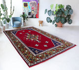 Vintage Turkish rug in a living room setting, Area rug in a living room setting, pile rug, Turkish rug, custom rug, modern rug, portland, rug shop, bright colors, wild shaman, soft rug, bold color, Portland, Oregon, rug store, rug shop, local shop