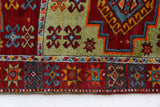 Vintage Turkish runner rug in a living room setting, pile rug, Turkish rug, vintage rug, portland, rug shop, bright colors, wild shaman, soft rug, bold color, Portland, Oregon, rug store, rug shop, local shop, antique rug