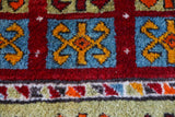 Vintage Turkish runner rug in a living room setting, pile rug, Turkish rug, vintage rug, portland, rug shop, bright colors, wild shaman, soft rug, bold color, Portland, Oregon, rug store, rug shop, local shop, antique rug