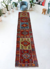 Vintage Turkish runner rug in a living room setting, pile rug, Turkish rug, vintage rug, portland, rug shop, bright colors, wild shaman, soft rug, bold color, Portland, Oregon, rug store, rug shop, local shop, antique rug