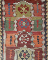 Vintage kilim rug in living room setting, old rug, antique rug, pastel colors, faded colors, Turkish rug, vintage rug, soft rug, Portland, Oregon, rug store, rug shop, local shop, earthy tones, earthy colors, warm colors