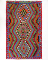 Vintage kilim rug in living room setting, bright colors, wild shaman, soft rug, bold color, Portland, Oregon, rug store, rug shop, local shop, vintage rug, modern kilim, warm colors, antique kilim rug