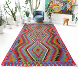 Vintage kilim rug in living room setting, bright colors, wild shaman, soft rug, bold color, Portland, Oregon, rug store, rug shop, local shop, vintage rug, modern kilim, warm colors, antique kilim rug