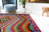 Vintage kilim rug in living room setting, bright colors, wild shaman, soft rug, bold color, Portland, Oregon, rug store, rug shop, local shop, vintage rug, modern kilim, warm colors, antique kilim rug