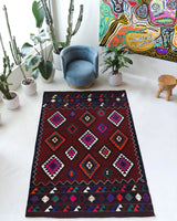 Vintage kilim rug in living room setting, bright colors, wild shaman, soft rug, bold color, Portland, Oregon, rug store, rug shop, local shop, vintage rug, modern kilim, warm colors, antique kilim rug