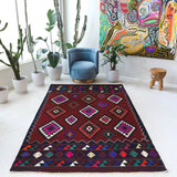 Vintage kilim rug in living room setting, bright colors, wild shaman, soft rug, bold color, Portland, Oregon, rug store, rug shop, local shop, vintage rug, modern kilim, warm colors, antique kilim rug