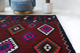 Vintage kilim rug in living room setting, bright colors, wild shaman, soft rug, bold color, Portland, Oregon, rug store, rug shop, local shop, vintage rug, modern kilim, warm colors, antique kilim rug
