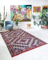 Vintage kilim rug in living room setting, bright colors, wild shaman, soft rug, bold color, Portland, Oregon, rug store, rug shop, local shop, vintage rug, modern kilim, warm colors, antique kilim rug