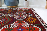 Vintage kilim rug in living room setting, bright colors, wild shaman, soft rug, bold color, Portland, Oregon, rug store, rug shop, local shop, vintage rug, modern kilim, warm colors, antique kilim rug