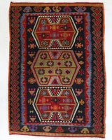 Vintage kilim rug in living room setting, bright colors, wild shaman, soft rug, bold color, Portland, Oregon, rug store, rug shop, local shop, vintage rug, modern kilim, warm colors, antique kilim rug