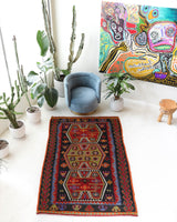 Vintage kilim rug in living room setting, bright colors, wild shaman, soft rug, bold color, Portland, Oregon, rug store, rug shop, local shop, vintage rug, modern kilim, warm colors, antique kilim rug