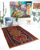 Vintage kilim rug in living room setting, bright colors, wild shaman, soft rug, bold color, Portland, Oregon, rug store, rug shop, local shop, vintage rug, modern kilim, warm colors, antique kilim rug