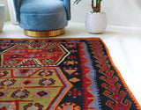 Vintage kilim rug in living room setting, bright colors, wild shaman, soft rug, bold color, Portland, Oregon, rug store, rug shop, local shop, vintage rug, modern kilim, warm colors, antique kilim rug