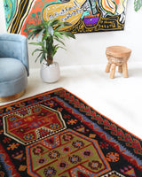 Vintage kilim rug in living room setting, bright colors, wild shaman, soft rug, bold color, Portland, Oregon, rug store, rug shop, local shop, vintage rug, modern kilim, warm colors, antique kilim rug
