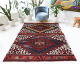 Vintage kilim rug in living room setting, old rug, antique rug, pastel colors, faded colors, Turkish rug, vintage rug, soft rug, Portland, Oregon, rug store, rug shop, local shop, earthy tones, earthy colors, warm colors