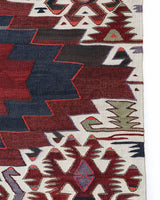 Vintage kilim rug in living room setting, old rug, antique rug, pastel colors, faded colors, Turkish rug, vintage rug, soft rug, Portland, Oregon, rug store, rug shop, local shop, earthy tones, earthy colors, warm colors