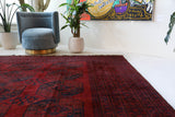 Antique Turkmen rug in a living room setting, pile rug, Turkish rug, vintage rug, portland, rug shop, bright colors, wild shaman, soft rug, bold color, Portland, Oregon, rug store, rug shop, local shop, antique rug