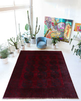 Antique Turkmen rug in a living room setting, pile rug, Turkish rug, vintage rug, portland, rug shop, bright colors, wild shaman, soft rug, bold color, Portland, Oregon, rug store, rug shop, local shop, antique rug