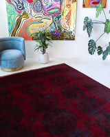 Antique Turkmen rug in a living room setting, pile rug, Turkish rug, vintage rug, portland, rug shop, bright colors, wild shaman, soft rug, bold color, Portland, Oregon, rug store, rug shop, local shop, antique rug