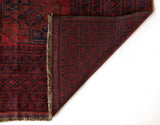 Antique Turkmen rug in a living room setting, pile rug, Turkish rug, vintage rug, portland, rug shop, bright colors, wild shaman, soft rug, bold color, Portland, Oregon, rug store, rug shop, local shop, antique rug