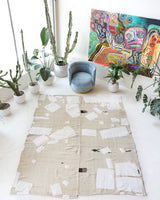 Vintage kilim rug in living room setting, old rug, antique rug, pastel colors, faded colors, Turkish rug, vintage rug, soft rug, Portland, Oregon, rug store, rug shop, local shop, earthy tones, earthy colors, warm colors