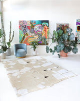 Vintage kilim rug in living room setting, old rug, antique rug, pastel colors, faded colors, Turkish rug, vintage rug, soft rug, Portland, Oregon, rug store, rug shop, local shop, earthy tones, earthy colors, warm colors