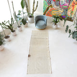 Vintage Turkish runner rug in living room setting, old rug, antique rug, pastel colors, faded colors, Turkish rug, vintage rug, soft rug, Portland, Oregon, rug store, rug shop, local shop