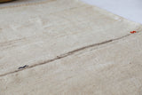 Vintage Turkish runner rug in living room setting, old rug, antique rug, pastel colors, faded colors, Turkish rug, vintage rug, soft rug, Portland, Oregon, rug store, rug shop, local shop