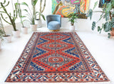 Vintage Turkish rug in a living room setting, pile rug, Turkish rug, vintage rug, portland, rug shop, bright colors, wild shaman, soft rug, bold color, Portland, Oregon, rug store, rug shop, local shop, antique rug