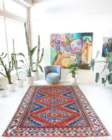 Vintage Turkish rug in a living room setting, pile rug, Turkish rug, vintage rug, portland, rug shop, bright colors, wild shaman, soft rug, bold color, Portland, Oregon, rug store, rug shop, local shop, antique rug