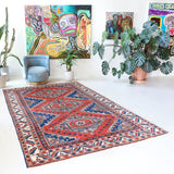 Vintage Turkish rug in a living room setting, pile rug, Turkish rug, vintage rug, portland, rug shop, bright colors, wild shaman, soft rug, bold color, Portland, Oregon, rug store, rug shop, local shop, antique rug