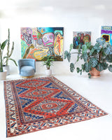 Vintage Turkish rug in a living room setting, pile rug, Turkish rug, vintage rug, portland, rug shop, bright colors, wild shaman, soft rug, bold color, Portland, Oregon, rug store, rug shop, local shop, antique rug