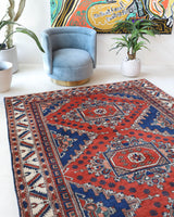 Vintage Turkish rug in a living room setting, pile rug, Turkish rug, vintage rug, portland, rug shop, bright colors, wild shaman, soft rug, bold color, Portland, Oregon, rug store, rug shop, local shop, antique rug