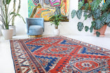 Vintage Turkish rug in a living room setting, pile rug, Turkish rug, vintage rug, portland, rug shop, bright colors, wild shaman, soft rug, bold color, Portland, Oregon, rug store, rug shop, local shop, antique rug
