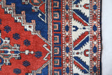 Vintage Turkish rug in a living room setting, pile rug, Turkish rug, vintage rug, portland, rug shop, bright colors, wild shaman, soft rug, bold color, Portland, Oregon, rug store, rug shop, local shop, antique rug
