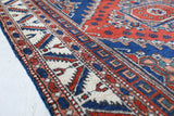 Vintage Turkish rug in a living room setting, pile rug, Turkish rug, vintage rug, portland, rug shop, bright colors, wild shaman, soft rug, bold color, Portland, Oregon, rug store, rug shop, local shop, antique rug