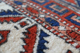 Vintage Turkish rug in a living room setting, pile rug, Turkish rug, vintage rug, portland, rug shop, bright colors, wild shaman, soft rug, bold color, Portland, Oregon, rug store, rug shop, local shop, antique rug