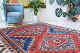 Vintage Turkish rug in a living room setting, pile rug, Turkish rug, vintage rug, portland, rug shop, bright colors, wild shaman, soft rug, bold color, Portland, Oregon, rug store, rug shop, local shop, antique rug