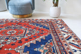 Vintage Turkish rug in a living room setting, pile rug, Turkish rug, vintage rug, portland, rug shop, bright colors, wild shaman, soft rug, bold color, Portland, Oregon, rug store, rug shop, local shop, antique rug
