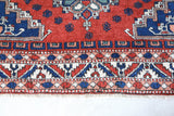 Vintage Turkish rug in a living room setting, pile rug, Turkish rug, vintage rug, portland, rug shop, bright colors, wild shaman, soft rug, bold color, Portland, Oregon, rug store, rug shop, local shop, antique rug