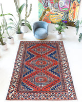 Vintage Turkish rug in a living room setting, pile rug, Turkish rug, vintage rug, portland, rug shop, bright colors, wild shaman, soft rug, bold color, Portland, Oregon, rug store, rug shop, local shop, antique rug