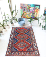 Vintage Turkish rug in a living room setting, pile rug, Turkish rug, vintage rug, portland, rug shop, bright colors, wild shaman, soft rug, bold color, Portland, Oregon, rug store, rug shop, local shop, antique rug