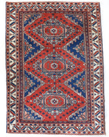 Vintage Turkish rug in a living room setting, pile rug, Turkish rug, vintage rug, portland, rug shop, bright colors, wild shaman, soft rug, bold color, Portland, Oregon, rug store, rug shop, local shop, antique rug